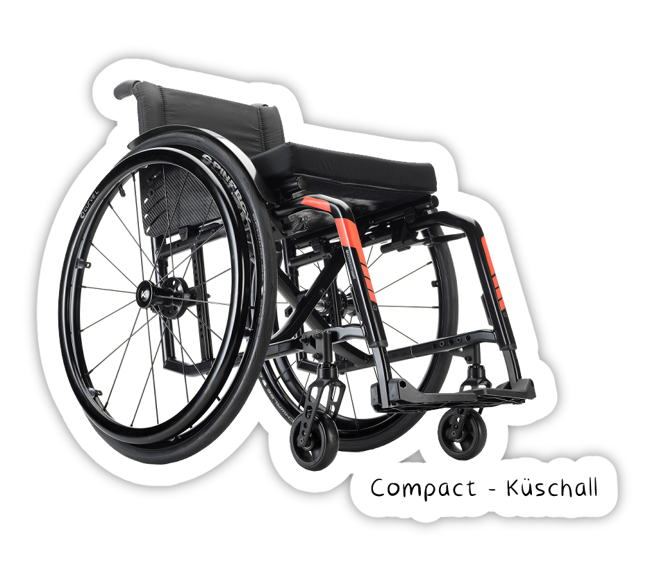 Photo du Compact de Küschall, un fautueil pliable avec croix, ont voit qu'il y a peu d'espace libre sous l'assise du fauteuil cadre le cadre et son mécanisme de pliage prennent beaucoup de place.